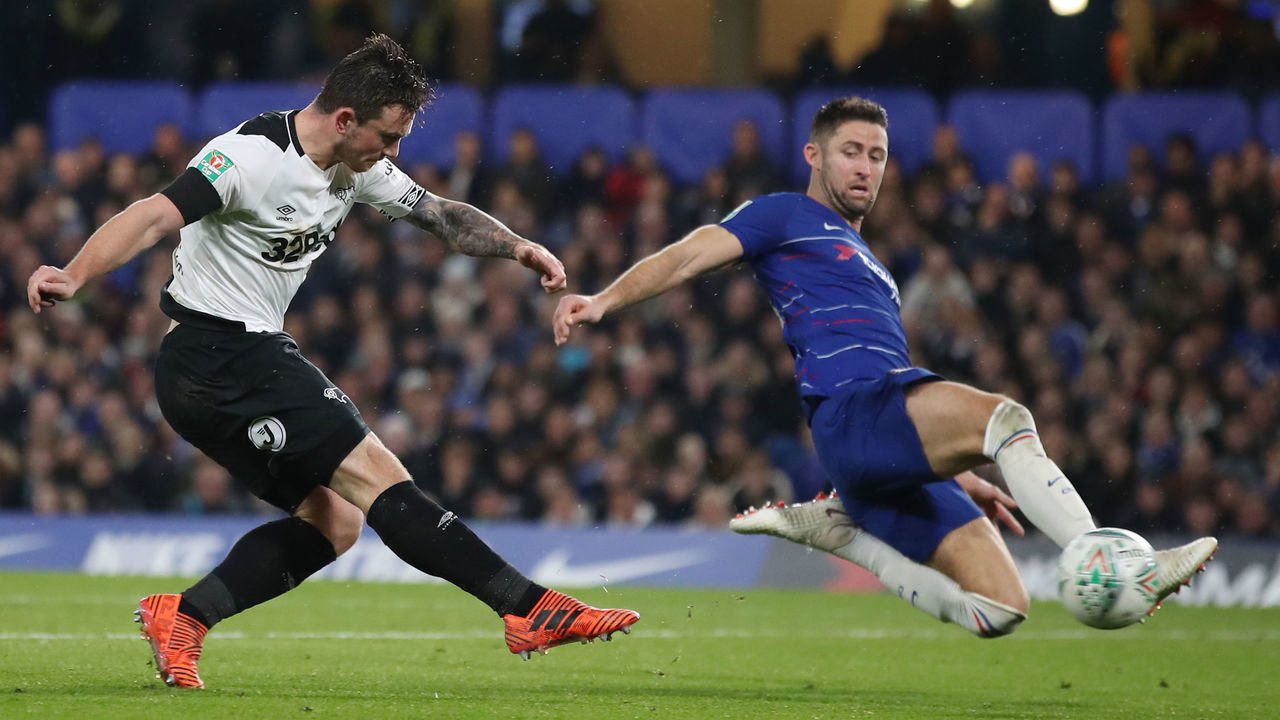 Derby County's Jack Marriott shoots at goal past Chelsea's Gary Cahill during the Carabao Cup, Fourth Round match at Stamford Bridge, London
