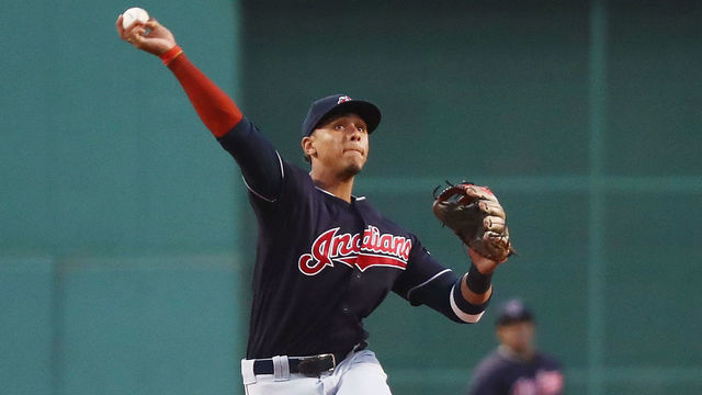 BOSTON, MA - AUGUST 22: Erik Gonzalez #9 of the Cleveland Indians makes a throw to first base in the first inning of a game against the Boston Red Sox at Fenway Park on August 22, 2018 in Boston, Massachusetts.