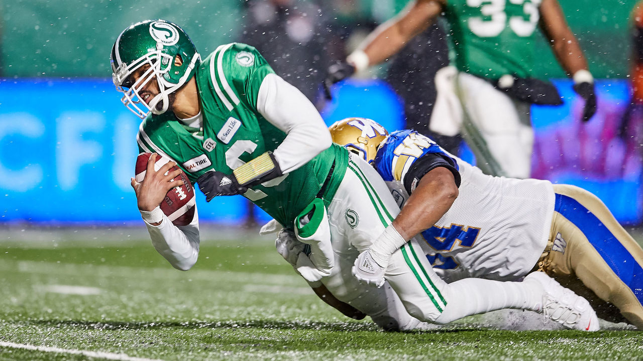 REGINA, SK - NOVEMBER 11: Brandon Bridge #16 of the Saskatchewan Roughriders is tackled after a run in the western semi final game between the Winnipeg Blue Bombers and Saskatchewan Roughriders at Mosaic Stadium on November 11, 2018 in Regina, Canada.
