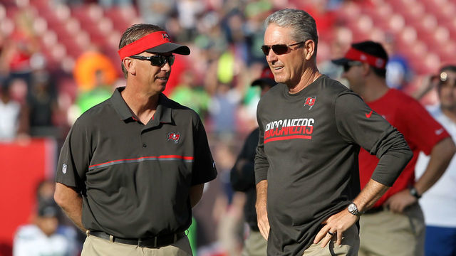 TAMPA, FL - NOVEMBER 27: Offensive Coordinator Todd Monken and Head Coach Dirk Koetter of the Buccaneers have a few words before the NFL Game between the Seattle Seahawks and Tampa Bay Buccaneers on November 27, 2016, at Raymond James Stadium in Tampa, FL.