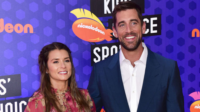 SANTA MONICA, CA - JULY 19: Race car driver Danica Patrick (L) and quarterback Aaron Rodgers attend Nickelodeon Kids' Choice Sports Awards 2018 at Barker Hangar on July 19, 2018 in Santa Monica, California.