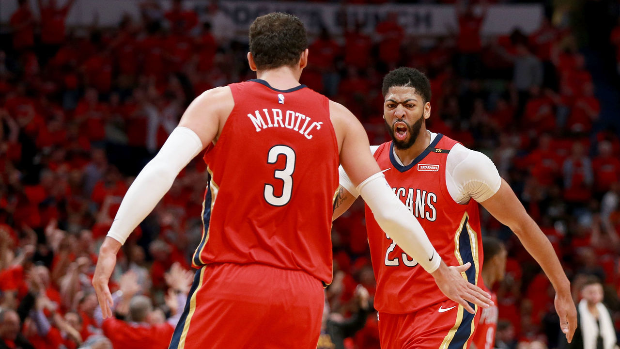 NEW ORLEANS, LA - APRIL 19: Anthony Davis #23 of the New Orleans Pelicans and Nikola Mirotic #3 of the New Orleans Pelicans react after scoring against the Portland Trail Blazers during Game 3 of the Western Conference playoffs at the Smoothie King Center on April 19, 2018 in New Orleans, Louisiana.