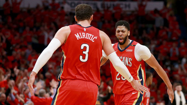 NEW ORLEANS, LA - APRIL 19: Anthony Davis #23 of the New Orleans Pelicans and Nikola Mirotic #3 of the New Orleans Pelicans react after scoring against the Portland Trail Blazers during Game 3 of the Western Conference playoffs at the Smoothie King Center on April 19, 2018 in New Orleans, Louisiana.