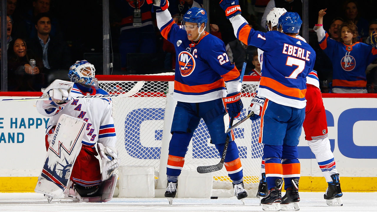 NEW YORK, NY - NOVEMBER 15: Anders Lee #27 of the New York Islanders celebrates his second period goal as Henrik Lundqvist #30 of the New York Rangers looks on at Barclays Center on November 15, 2018 the Brooklyn borough of New York City.