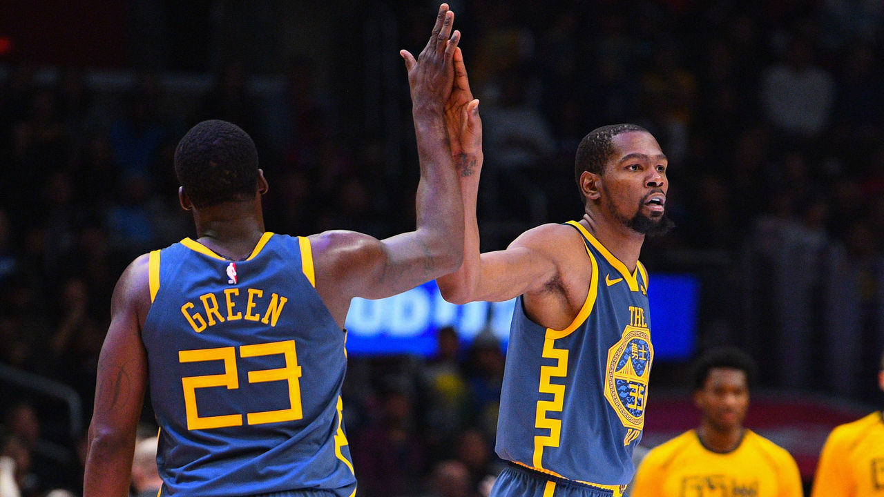 LOS ANGELES, CA - NOVEMBER 12: Golden State Warriors Forward Draymond Green (23) gives Golden State Warriors Forward Kevin Durant (35) a high five during a NBA game between the Golden State Warriors and the Los Angeles Clippers on November 12, 2018 at STAPLES Center in Los Angeles, CA.