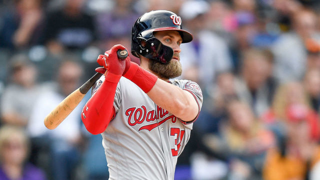 DENVER, CO - SEPTEMBER 30: Bryce Harper #34 of the Washington Nationals hits a ninth inning double against the Colorado Rockies at Coors Field on September 30, 2018 in Denver, Colorado.