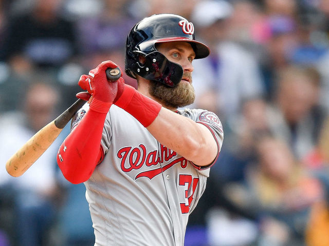 DENVER, CO - SEPTEMBER 30: Bryce Harper #34 of the Washington Nationals hits a ninth inning double against the Colorado Rockies at Coors Field on September 30, 2018 in Denver, Colorado.