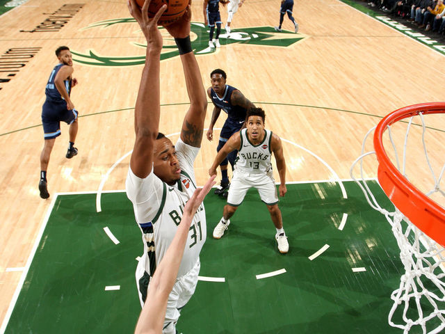 MILWAUKEE, WI - NOVEMBER 14: John Henson #31 of the Milwaukee Bucks shoots the ball against the Memphis Grizzlies on November 14, 2018 at the Fiserv Forum in Milwaukee, Wisconsin. Mandatory Copyright Notice: Copyright 2018 NBAE
