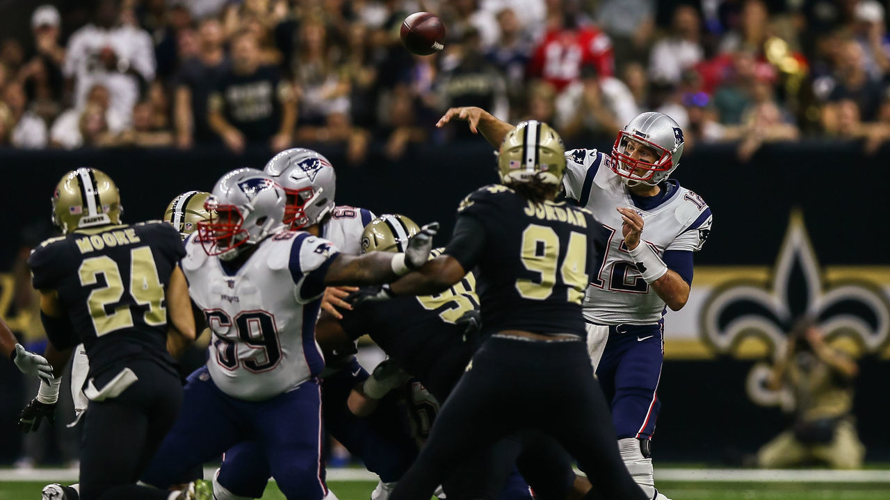 NEW ORLEANS, LA. - SEPTEMBER 17: \h12\ passes against New Orleans Saints defensive end Cameron Jordan (94) during the game between between the New England Patriots and the New Orleans Saints on September 17, 2017 at the Mercedes-Benz Superdome in New Orleans, LA. New England Patriots won 36-20.