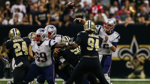 NEW ORLEANS, LA. - SEPTEMBER 17: \h12\ passes against New Orleans Saints defensive end Cameron Jordan (94) during the game between between the New England Patriots and the New Orleans Saints on September 17, 2017 at the Mercedes-Benz Superdome in New Orleans, LA. New England Patriots won 36-20.
