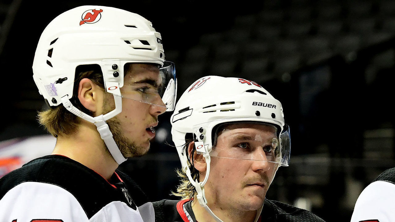 NEW YORK, NY - NOVEMBER 3: Nico Hischier #13 of the New Jersey Devils, Sami Vatanen #45 of the New Jersey Devils, Taylor Hall #9 of the New Jersey Devils, and Kyle Palmieri #21 of the New Jersey Devils huddle during the game against New York Islanders at Barclays Center on November 3, 2018 in the Brooklyn borough of New York City.