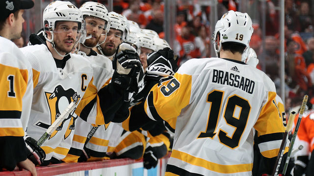 PHILADELPHIA, PA - APRIL 15: Sidney Crosby #87 of the Pittsburgh Penguins celebrates a second period goal from the bench with teammate Derick Brassard #19 against the Philadelphia Flyers in Game Three of the Eastern Conference First Round during the 2018 NHL Stanley Cup Playoffs at the Wells Fargo Center on April 15, 2018 in Philadelphia, Pennsylvania.