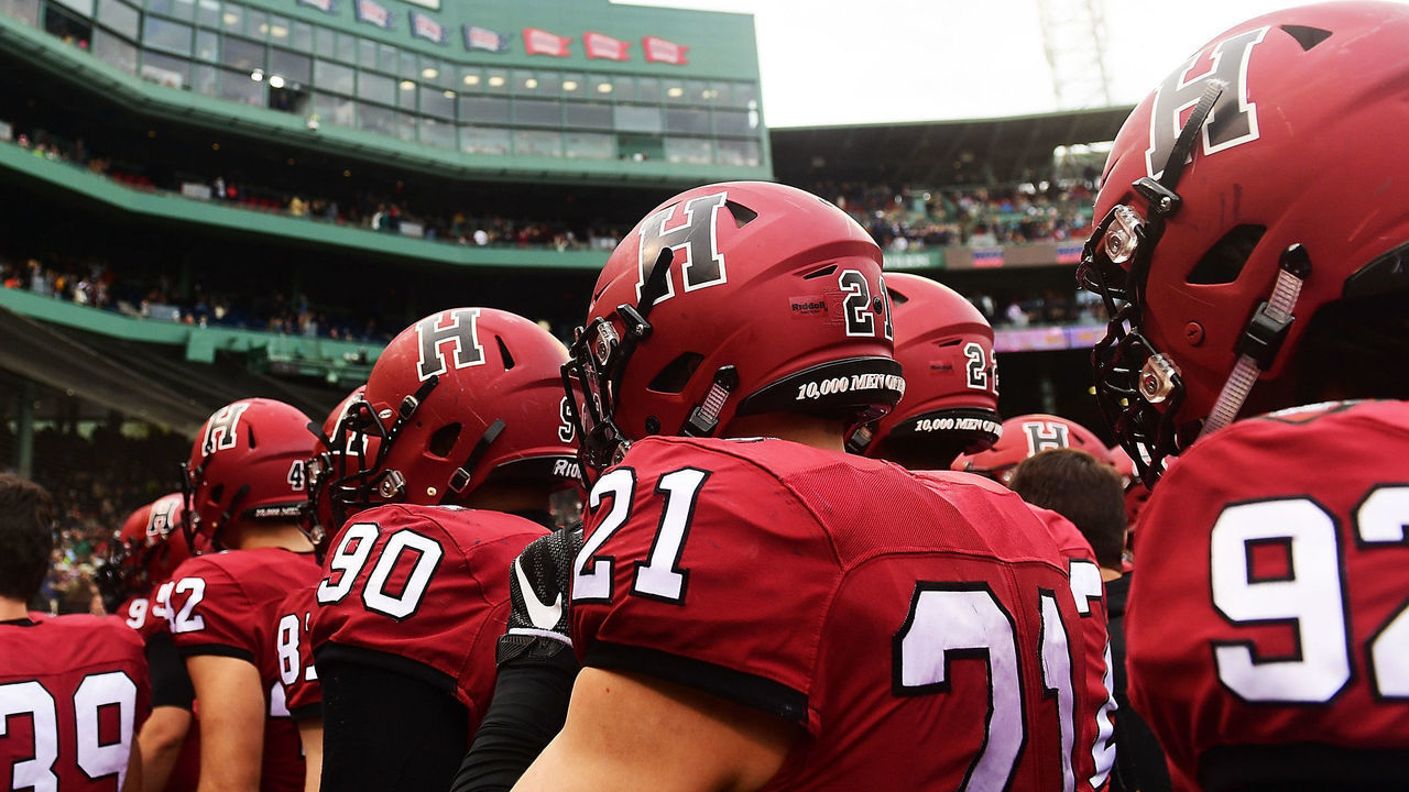BOSTON, MA - NOVEMBER 17: The Harvard Crimson head to the locker room at the end of the second half of a game against the Yale Bulldogs at Fenway Park on November 17, 2018 in Boston, Massachusetts.