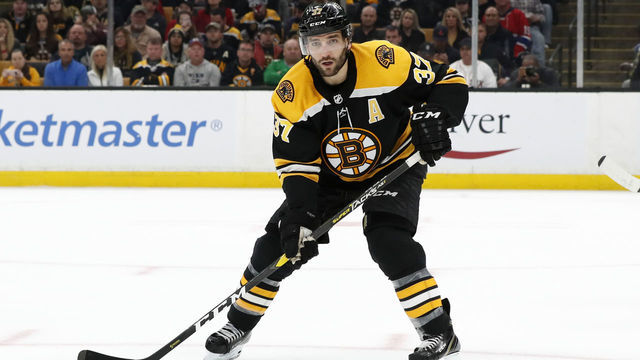 BOSTON, MA - OCTOBER 27: Boston Bruins center Patrice Bergeron (37) looks for the pass during a game between the Boston Bruins and the Montreal Canadians on October 27, 2018, at TD Garden in Boston, Massachusetts.