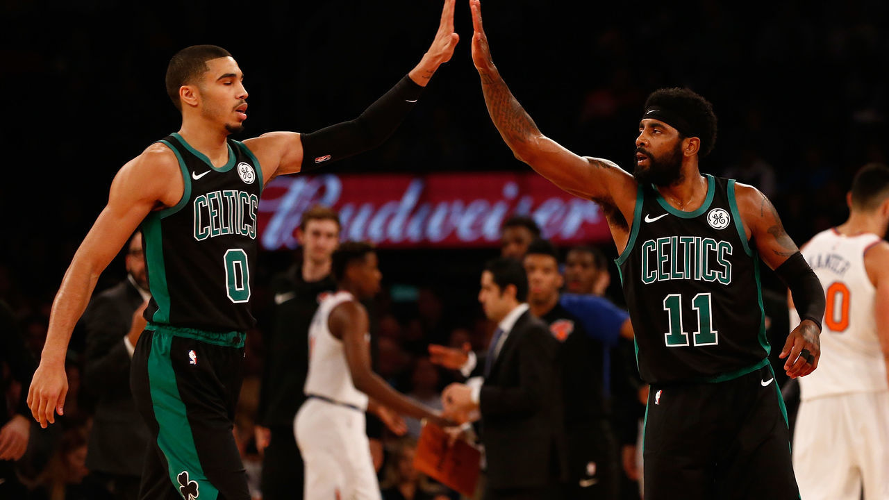 NEW YORK, NY - OCTOBER 20: Kyrie Irving #11 and Jayson Tatum #0 of the Boston Celtics in action against the New York Knicks at Madison Square Garden on October 20, 2018 in New York City. Boston Celtics defeated the New York Knicks 103-101.