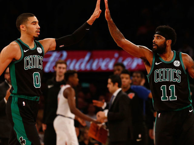 NEW YORK, NY - OCTOBER 20: Kyrie Irving #11 and Jayson Tatum #0 of the Boston Celtics in action against the New York Knicks at Madison Square Garden on October 20, 2018 in New York City. Boston Celtics defeated the New York Knicks 103-101.