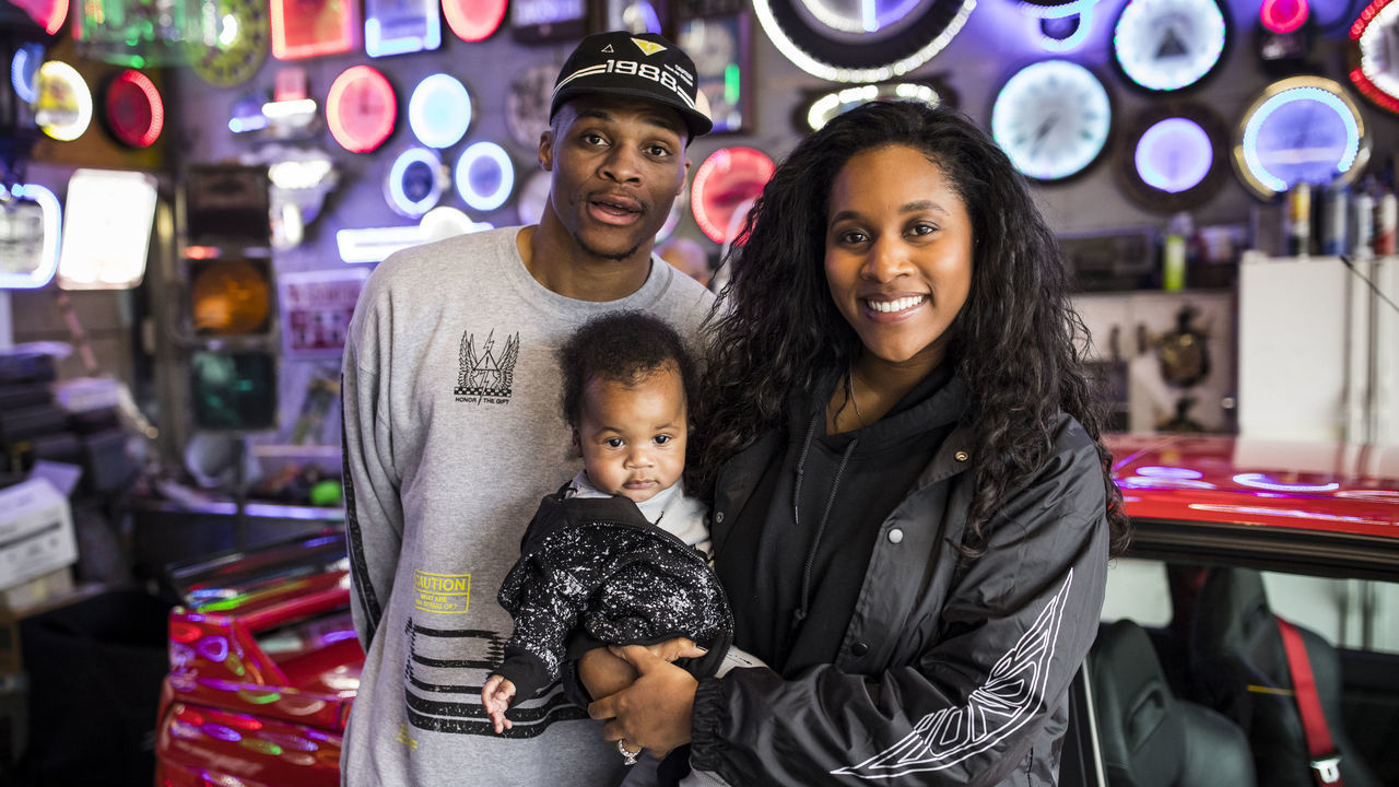 OKLAHOMA CITY, OK - OCTOBER 11: Russell Westbrook #0 of the Oklahoma City Thunder is joined by wife, Nina, and son Noah at the release of Russell Westbrook's Honor The Gift apparel line at Penn Automotive in Oklahoma City, OK on November 11, 2017. Mandatory Copyright Notice: Copyright 2017 NBAE