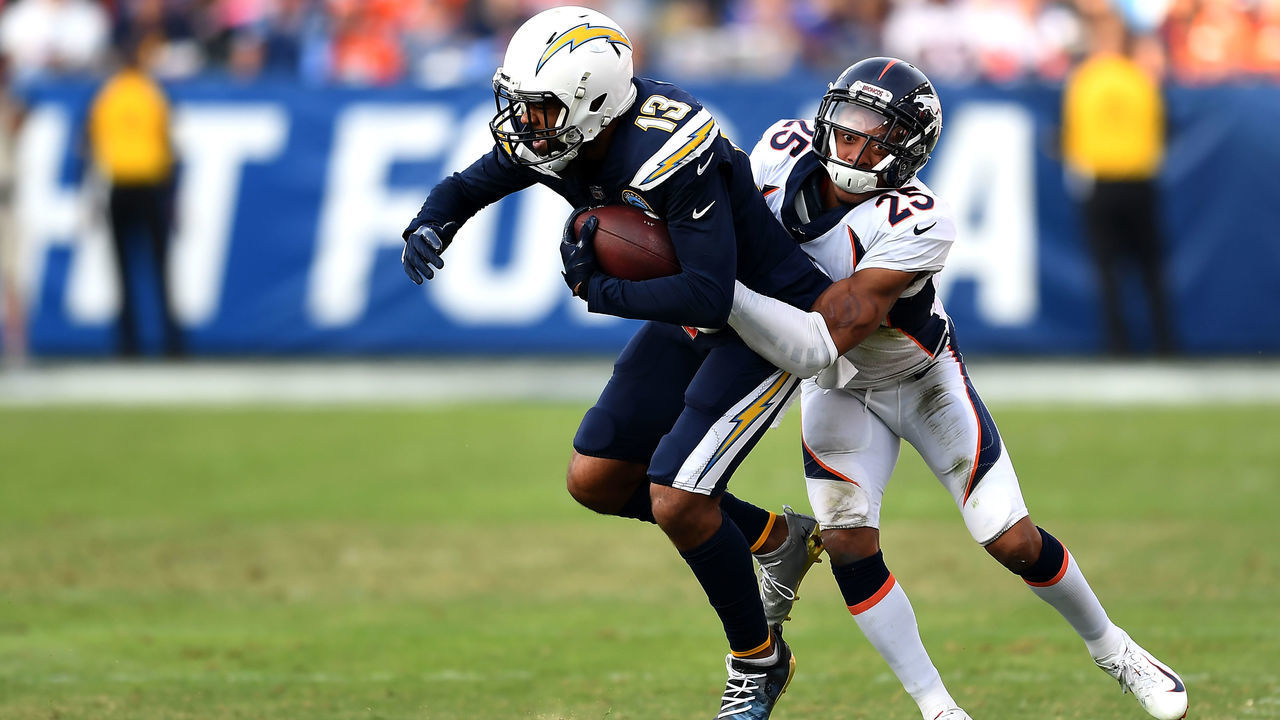 CARSON, CA - NOVEMBER 18: Cornerback Chris Harris #25 of the Denver Broncos corrals wide receiver Keenan Allen #13 of the Los Angeles Chargers in the second half of their game over the Los Angeles Chargers at the StubHub Center November 18, 2018 in Carson, California.