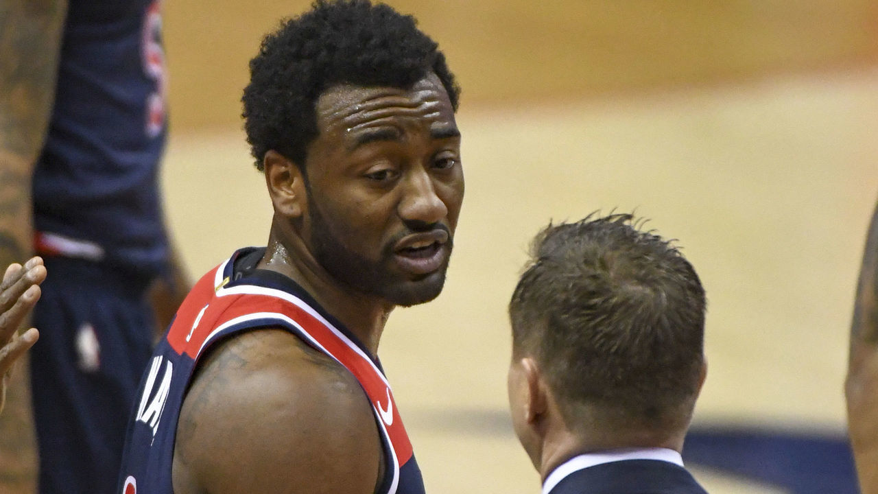 WASHINGTON, DC - APRIL 10: Washington Wizards guard John Wall (2) talks with Washington Wizards head coach Scott Brooks (R) during the game against the Boston Celtics on April 10, 2018 at the Capital One Arena in Washington, D.C.
