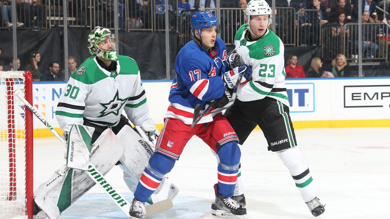 NEW YORK, NY - NOVEMBER 19: Jesper Fast #17 of the New York Rangers skates against Esa Lindell #23 and Ben Bishop #30 of the Dallas Stars at Madison Square Garden on November 19, 2018 in New York City.
