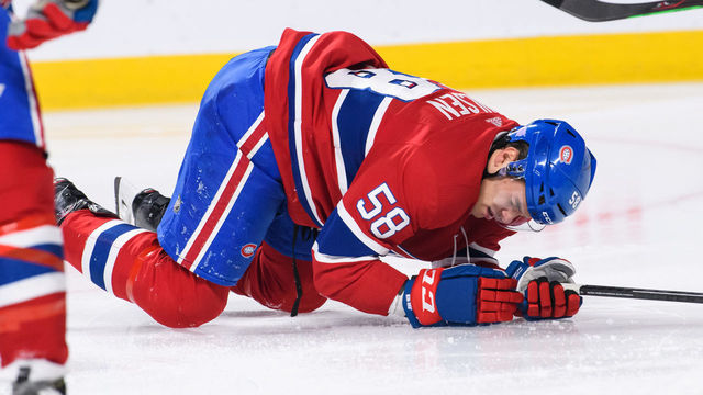 MONTREAL, QC - NOVEMBER 19: Montreal Canadiens defenseman Noah Juulsen (58) receives a puck in the visor during the first period of the NHL game between the Washington Capitals and the Montreal Canadiens on November 19, 2018, at the Bell Centre in Montreal, QC