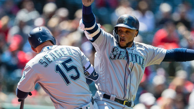 CLEVELAND, OH - APRIL 29: Kyle Seager #15 celebrates with Robinson Cano #22 of the Seattle Mariners after Cano hitt a two run home run during the second inning against the Cleveland Indians at Progressive Field on April 29, 2018 in Cleveland, Ohio.