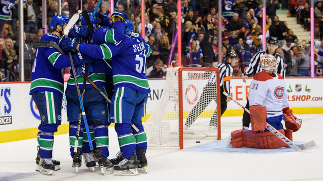 VANCOUVER, BC - NOVEMBER 17: Vancouver Canucks defenseman Michael Del Zotto (4) is congratulated after scoring a goal on Montreal Canadiens goalie Carey Price (31) during their NHL game at Rogers Arena on November 17, 2018 in Vancouver, British Columbia, Canada.
