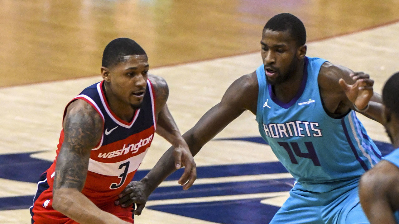 WASHINGTON, DC - MARCH 31: Washington Wizards guard Bradley Beal (3) drives on Charlotte Hornets forward Michael Kidd-Gilchrist (14) on March 31, 2018 at the Capital One Arena in Washington, D.C. The Washington Wizards defeated the Charlotte Hornets, 107-93 to clinch a playoff spot.