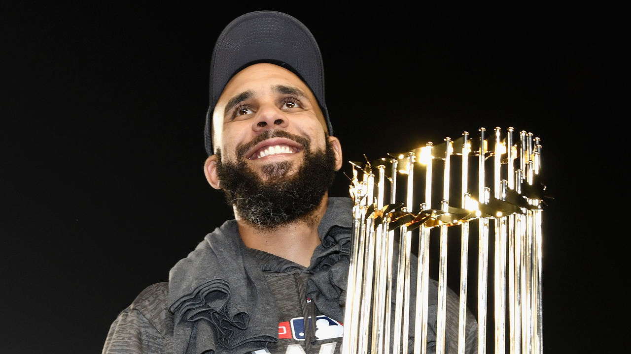 LOS ANGELES, CA - OCTOBER 28: David Price #24 of the Boston Red Sox celebrates with the World Series trophy after his team's 5-1 win over the Los Angeles Dodgers in Game Five to win the 2018 World Series at Dodger Stadium on October 28, 2018 in Los Angeles, California.