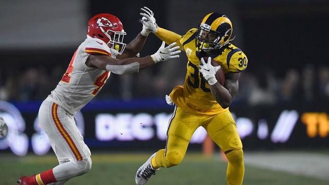 LOS ANGELES, CA - NOVEMBER 19: Todd Gurley #30 of the Los Angeles Rams fends off Dorian O'Daniel #44 of the Kansas City Chiefs during the third quarter of the game at Los Angeles Memorial Coliseum on November 19, 2018 in Los Angeles, California.