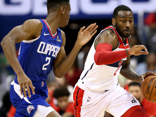 WASHINGTON, DC - NOVEMBER 20: John Wall #2 of the Washington Wizards dribbles past Shai Gilgeous-Alexander #2 of the LA Clippers during the second half at Capital One Arena on November 20, 2018 in Washington, DC.