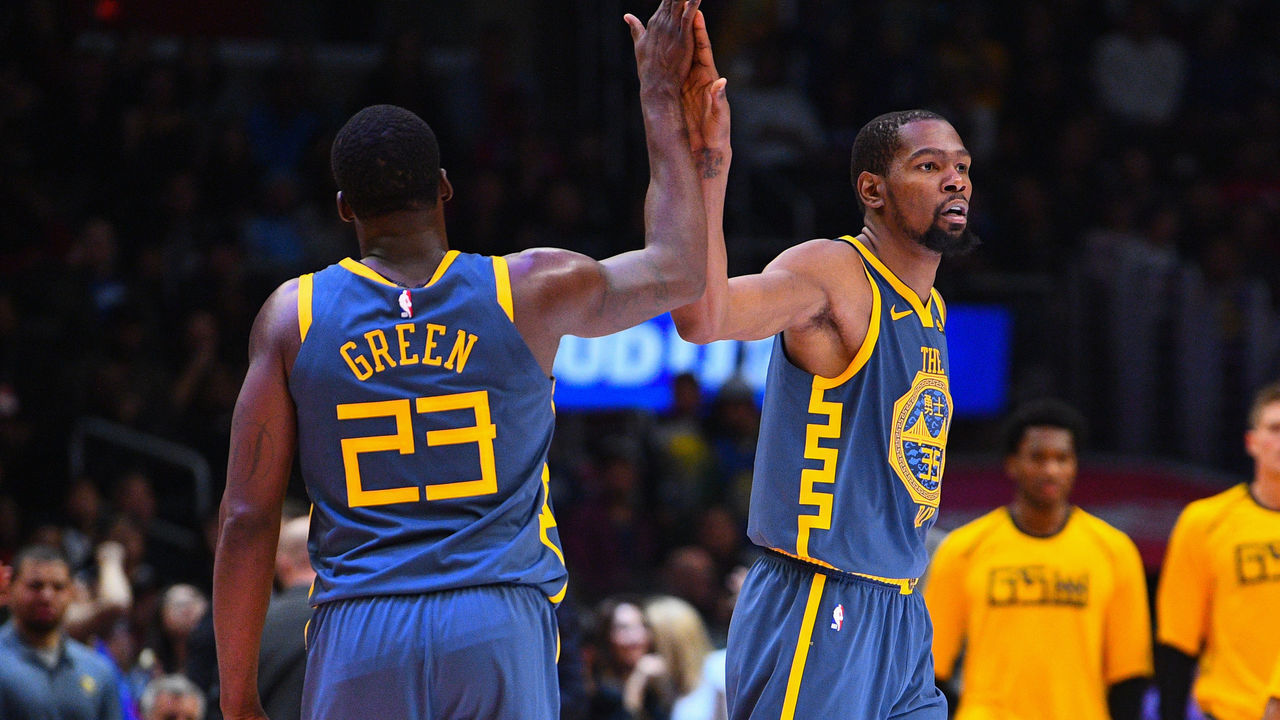 LOS ANGELES, CA - NOVEMBER 12: Golden State Warriors Forward Draymond Green (23) gives Golden State Warriors Forward Kevin Durant (35) a high five during a NBA game between the Golden State Warriors and the Los Angeles Clippers on November 12, 2018 at STAPLES Center in Los Angeles, CA.