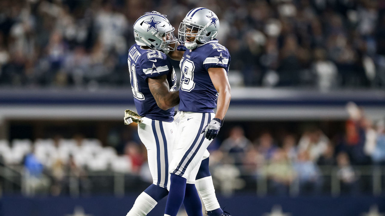 ARLINGTON, TX - NOVEMBER 05: Dallas Cowboys wide receiver Amari Cooper (19) celebrates his touchdown with running back Ezekiel Elliott (21) during the game between the Tennessee Titans and Dallas Cowboys on November 5, 2018 at AT&T Stadium in Arlington, TX.
