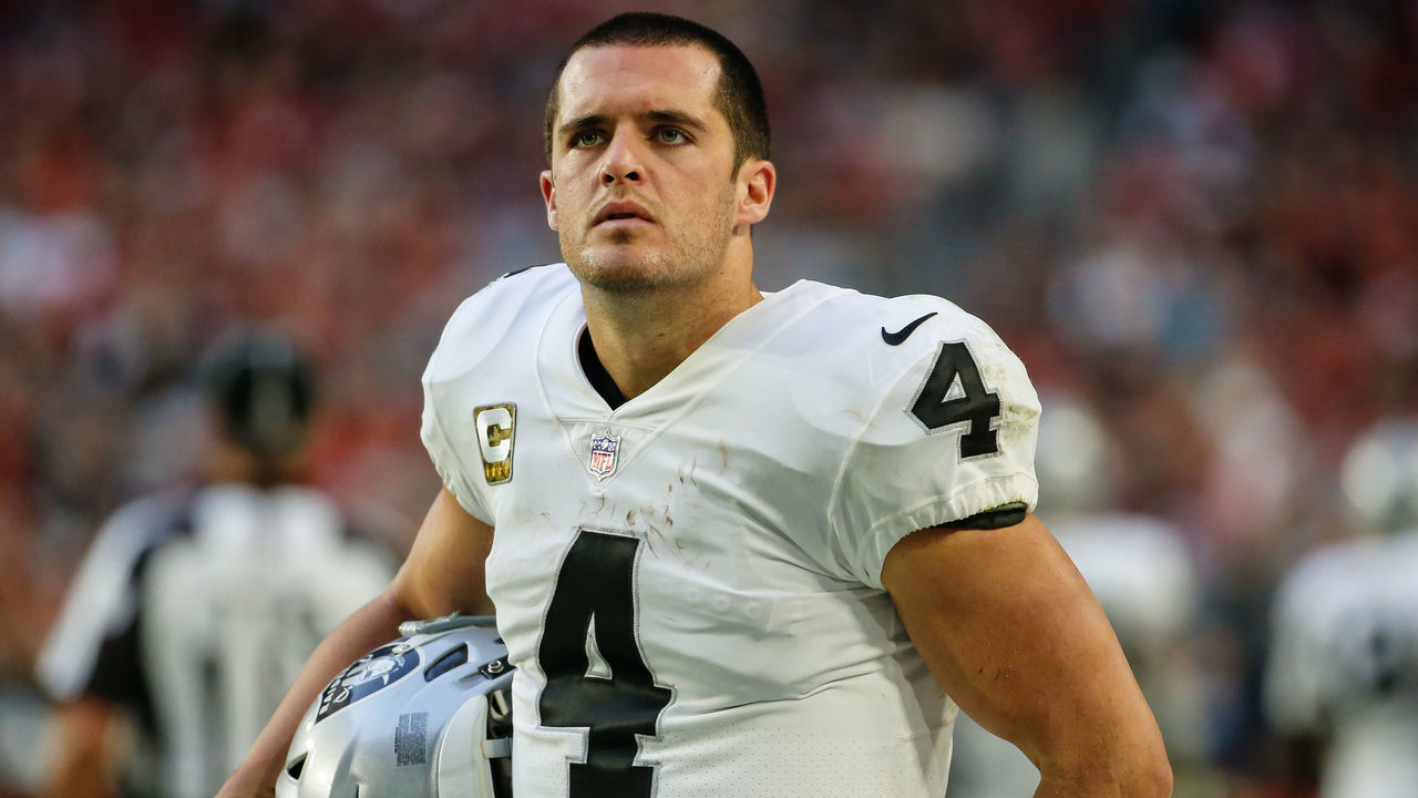 GLENDALE, AZ - NOVEMBER 18: Oakland Raiders quarterback Derek Carr (4) looks on during the NFL football game between the Oakland Raiders and the Arizona Cardinals on November 18, 2018 at State Farm Stadium in Glendale, Arizona.