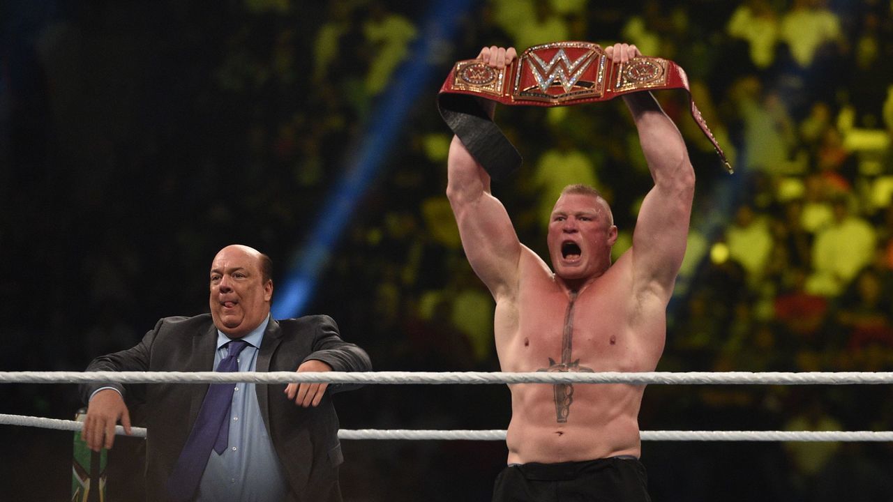 Brock Lesnar celebrates, with his manager Paul Heyman, after winning the WWE Universal Championship match as part of as part of the World Wrestling Entertainment (WWE) Crown Jewel pay-per-view at the King Saud University Stadium in Riyadh on November 2, 2018.