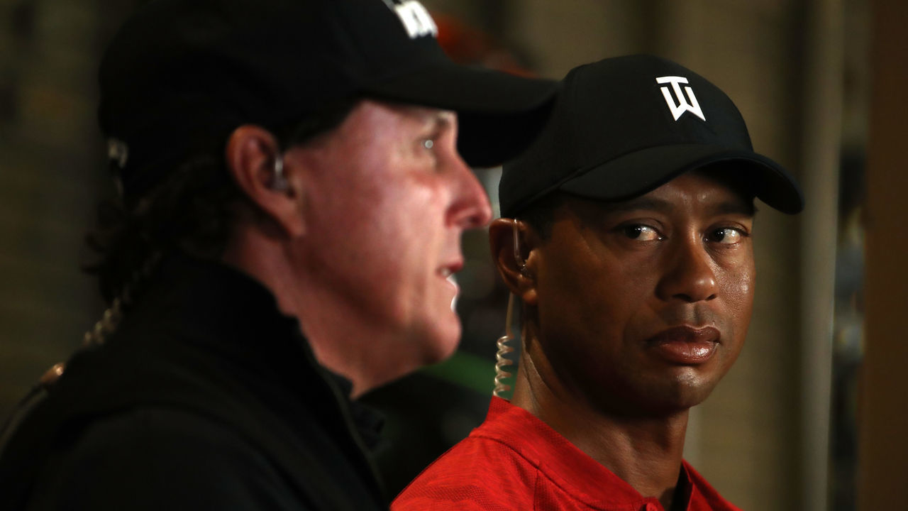 LAS VEGAS, NV - NOVEMBER 20: (EXCLUSIVE COVERAGE) Tiger Woods looks over at Phil Mickelson as they do a spot for TV before The Match at Shadow Creek Golf Course on November 20, 2018 in Las Vegas, Nevada.