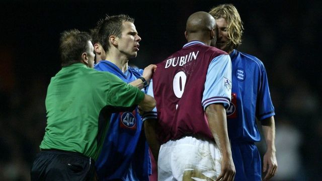 Referee Mike Halsey breaks up a disagreement between Aston Villa's Dion Dublin and Birmingham City's Robbie Savage during their FA Barclaycard Premiership game at Villa Park, Birmingham. Dublin was sent off for headbutting Savage. THIS PICTURE CAN ONLY BE USED WITHIN THE CONTEXT OF AN EDITORIAL FEATURE. NO WEBSITE/INTERNET USE UNLESS SITE IS REGISTERED WITH FOOTBALL ASSOCIATION PREMIER LEAGUE.