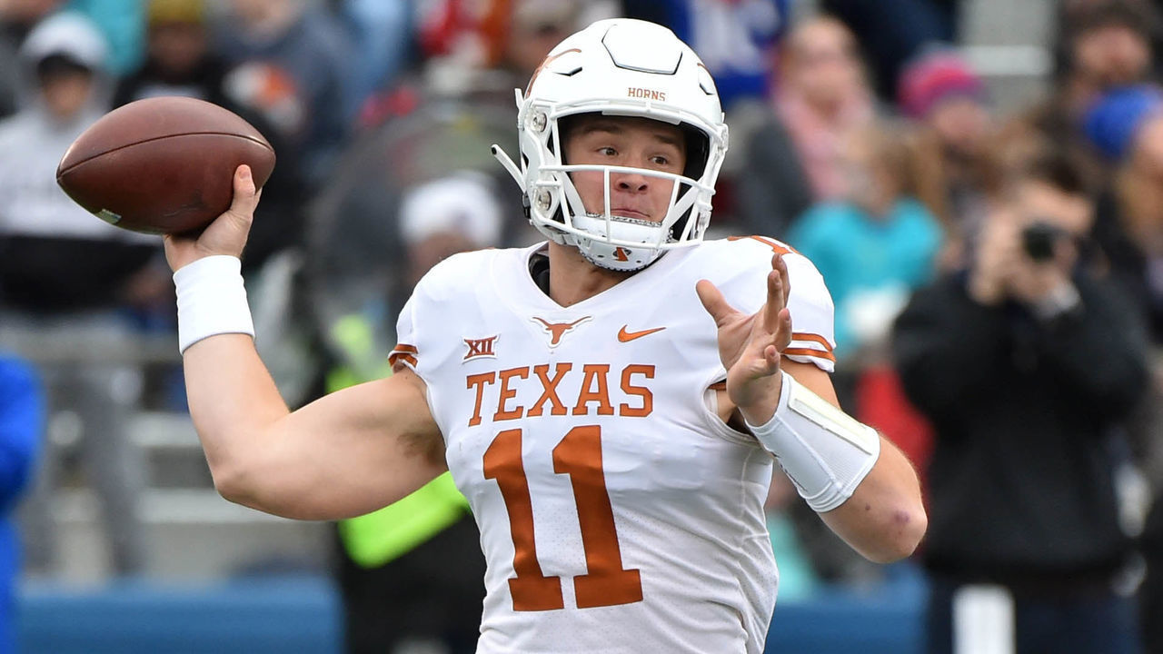 LAWRENCE, KANSAS - NOVEMBER 23: Quarterback Sam Ehlinger #11 of the Texas Longhorns passes against the Kansas Jayhawks in second quarter at Memorial Stadium on November 23, 2018 in Lawrence, Kansas.