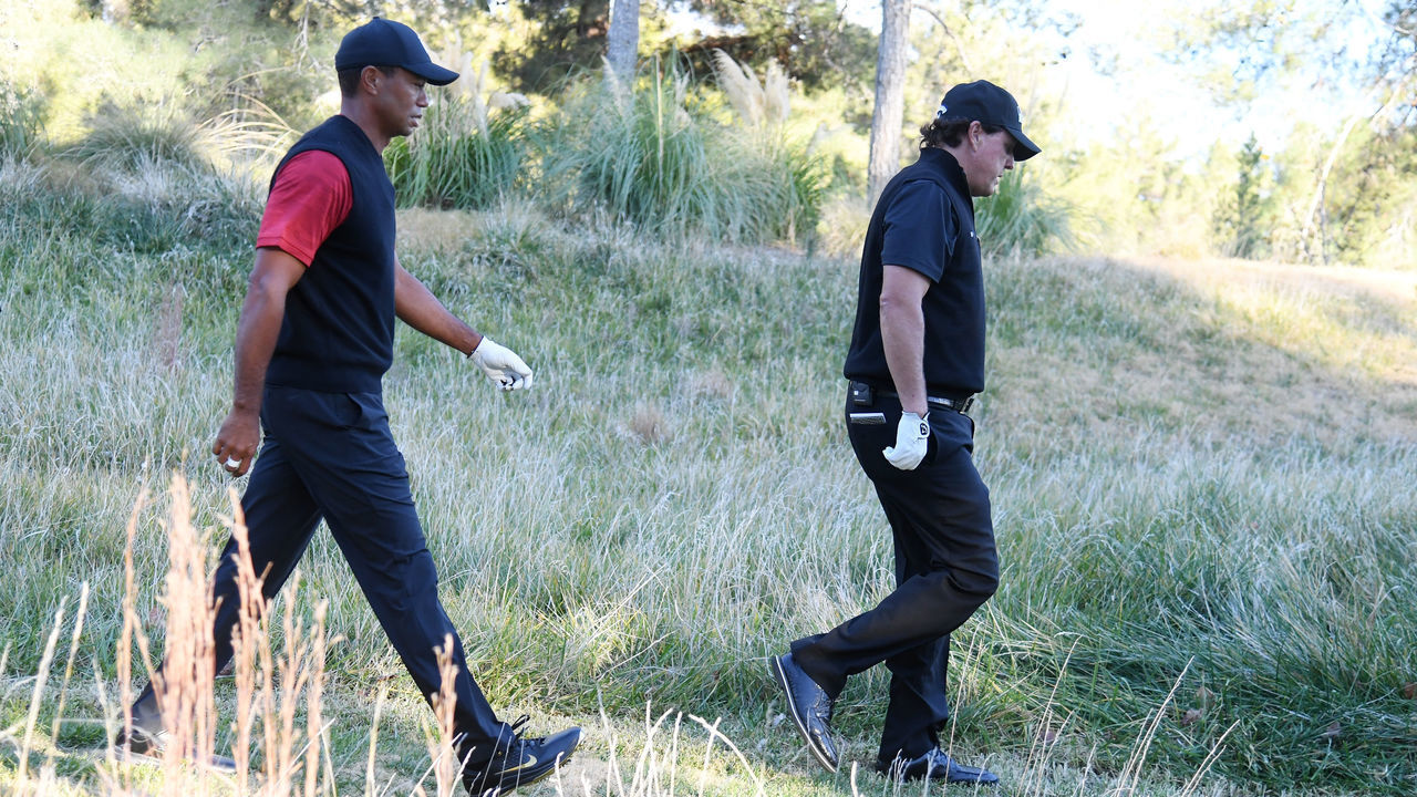 LAS VEGAS, NV - NOVEMBER 23: Tiger Woods and Phil Mickelson walk from the 14th tee during The Match: Tiger vs Phil at Shadow Creek Golf Course on November 23, 2018 in Las Vegas, Nevada.