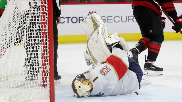 RALEIGH, NC - NOVEMBER 23: Roberto Luongo #1 of the Florida Panthers goes down in the crease with a lower body injury during an NHL game against the Carolina Hurricanes on November 23, 2018 at PNC Arena in Raleigh, North Carolina.