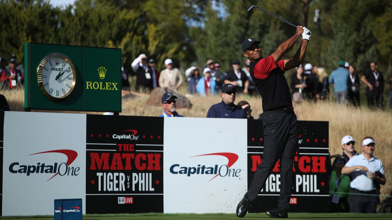 LAS VEGAS, NV - NOVEMBER 23: Tiger Woods plays a shot during The Match: Tiger vs Phil at Shadow Creek Golf Course on November 23, 2018 in Las Vegas, Nevada.
