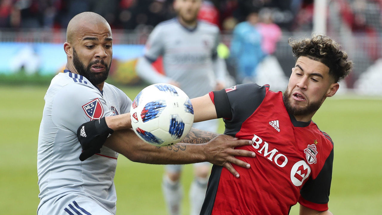 TORONTO, ON - April 28 In first half action, Kevin Ellis battles with Toronto FC midfielder Jonathan Osorio (21). Toronto FC (TFC )tied Chicago Fire 2-2 in MLS soccer action at BMO Field in Toronto. April 28, 2018 (Richard Lautens/Toronto Star via Getty Images)