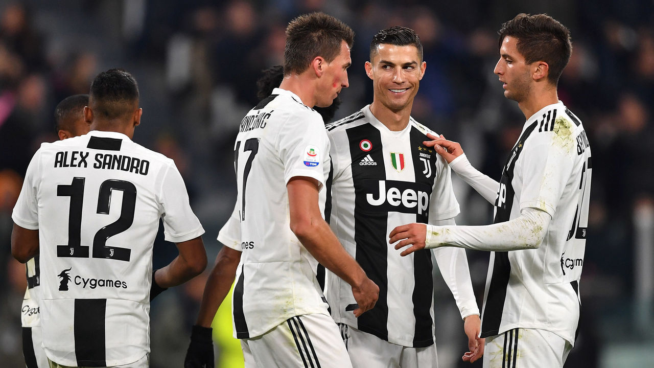 TURIN, ITALY - NOVEMBER 24: Mario Mandzukic of Juventus celebrates after his goal of 2-0 with teammates Cristiano Ronaldo and Rodrigo Bentancur during the Serie A match between Juventus and SPAL at Allianz Stadium on November 24, 2018 in Turin, Italy.