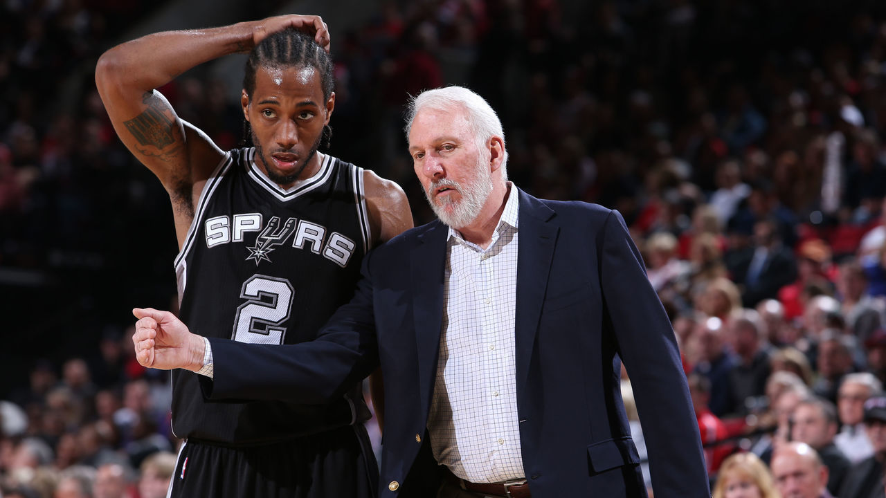 PORTLAND, OR - DECEMBER 15: Kawhi Leonard #2 and Gregg Popovich of the San Antonio Spurs talk against the Portland Trail Blazers on December 15, 2014 at the Moda Center Arena in Portland, Oregon. Mandatory Copyright Notice: Copyright 2014 NBAE