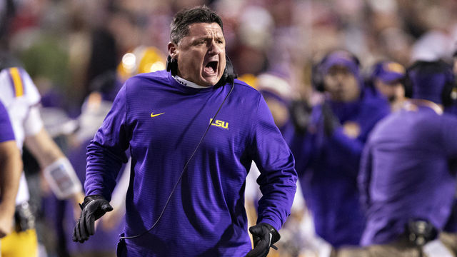 FAYETTEVILLE, AR - NOVEMBER 10: Head Coach Ed Orgeron of the LSU Tigers celebrates with his team coming off the field after scoring a touchdown in the second half of a game against the Arkansas Razorbacks at Razorback Stadium on November 10, 2018 in Fayetteville, Arkansas.