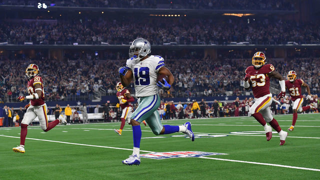 ARLINGTON, TEXAS - NOVEMBER 22: Dallas Cowboys wide receiver Amari Cooper (19) breaks away for a touchdown after a catch during the third quarter in a game against the Washington Redskins and Dallas Cowboys at AT&T Stadium on November 22, 2018 in Arlington, Tx. Dallas beat Washington 31-23.
