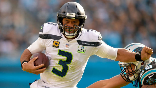 CHARLOTTE, NC - NOVEMBER 25: Wes Horton #96 of the Carolina Panthers pressures Russell Wilson #3 of the Seattle Seahawks during the first half of their game at Bank of America Stadium on November 25, 2018 in Charlotte, North Carolina.