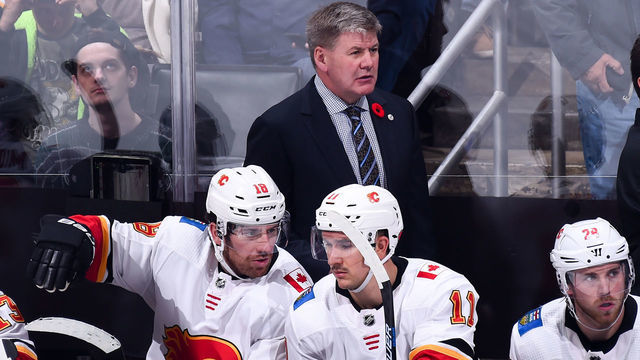 LOS ANGELES, CA - NOVEMBER 10: Head coach Bill Peters of the Calgary Flames watches play with James Neal #18 and Mikael Backlund #11 on the bench during the third period of the game against the Los Angeles Kings at STAPLES Center on November 10, 2018 in Los Angeles, California. *** Local Caption ***