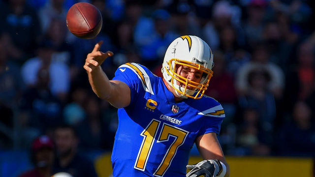CARSON, CA - DECEMBER 03: Chargers Philip Rivers fires a pass on the run at StubHub Center in Carson on Sunday, December 3, 2017.