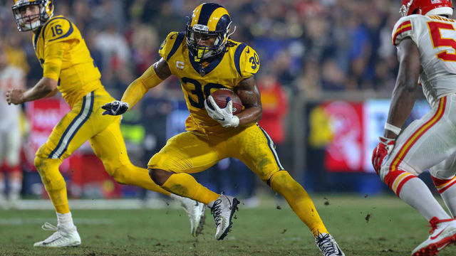 LOS ANGELES, CA - NOVEMBER 19: Los Angeles Rams running back Todd Gurley (30) runs for a gain during a NFL game between the Kansas City Chiefs and the Los Angeles Rams on November 19, 2018, at the Los Angeles Memorial Coliseum in Los Angeles, CA.